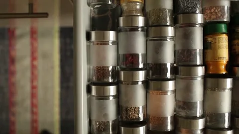 Spices in glass jars Stock Footage 73438364