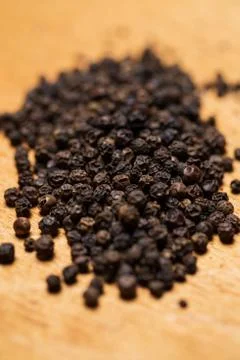 Spices. Heap of pepper on the table Stock Photos