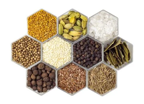 Spices in hexagonal jars isolated on a white background Stock Photos