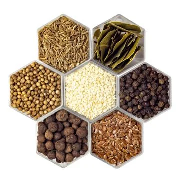 Spices in hexagonal jars isolated on a white background Stock Photos
