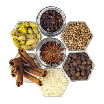Spices in hexagonal jars isolated on a white background Stock Photos