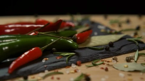 Spices Layed Out on a Rotating Stone Plate Stock Footage 107766279