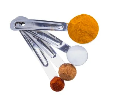 Spices in measuring spoons. Stock Photos