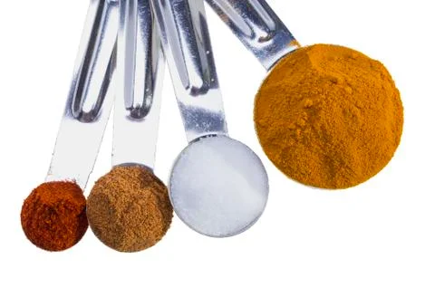 Spices in measuring spoons. Stock Photos