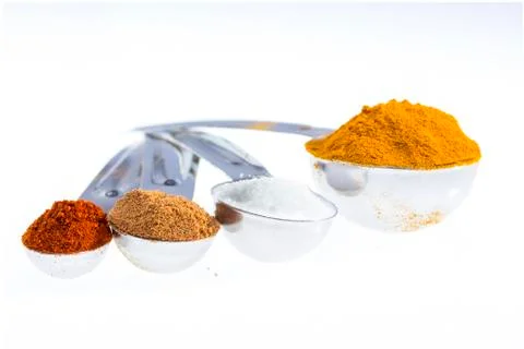 Spices in measuring spoons. Stock Photos
