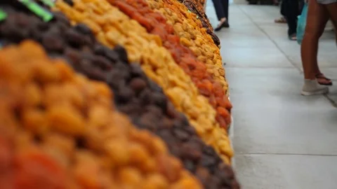 Spices, nuts, dried fruits on display at market on the counter, 4k, slow-motion Stock Footage 80478721