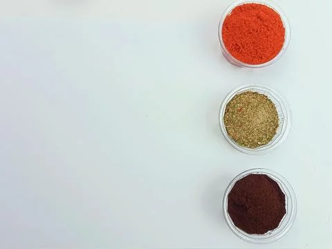 Spices in Plastic Containers on White Background with Copy Space Stock Photos