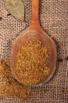 Spices on spoon Stock Photos