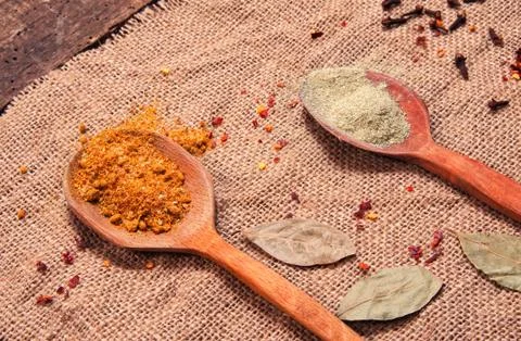 Spices on spoon Stock Photos