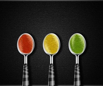 Spices on spoons Stock Photos