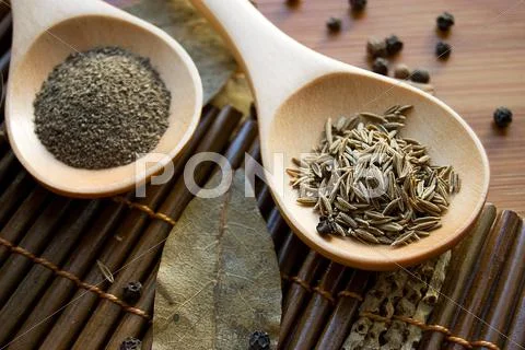 Spices on wooden plate Stock Photos