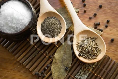 Spices on wooden plate Stock Photos