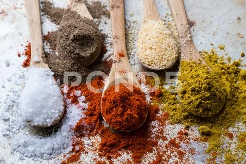 Spices In Wooden Spoons