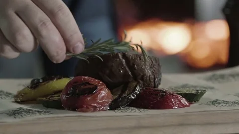Spicing Grilled beef steak on the plate with vegetables Video stock 70738845