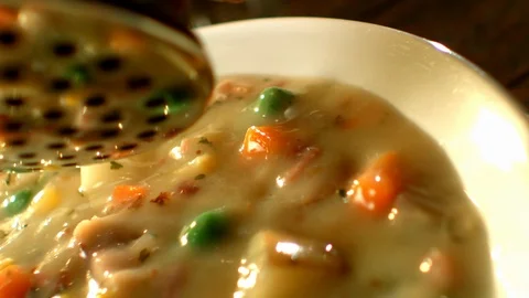 Spicing vegetable soup in slow motion Stock Footage 120462213