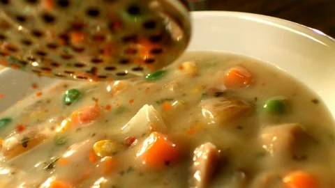 Spicing vegetable soup in slow motion Stock Footage 120462214
