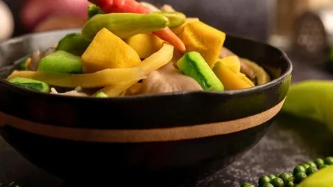 Spicy and savory vegetable curry in a rustic bowl Stock Photos