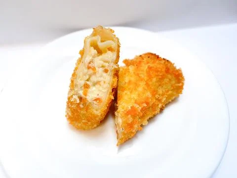 Spicy chicken risoles served on white plate. Stock Photos