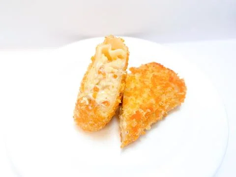 Spicy chicken risoles served on white plate. Stock Photos