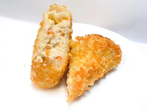 Spicy chicken risoles served on white plate. Stock Photos