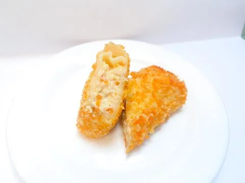 Spicy chicken risoles served on white plate. Stock Photos