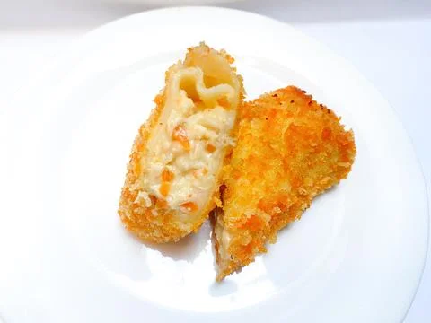 Spicy chicken risoles served on white plate. Stock Photos