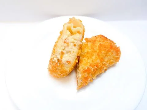 Spicy chicken risoles served on white plate. Stock Photos