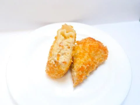 Spicy chicken risoles served on white plate. Stock Photos