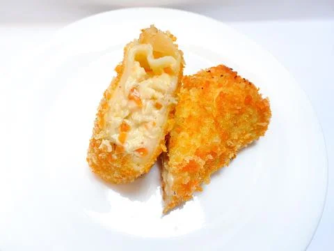 Spicy chicken risoles served on white plate. Stock Photos