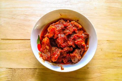 Spicy cooked beef in a bowl is usually asian food Stock Photos