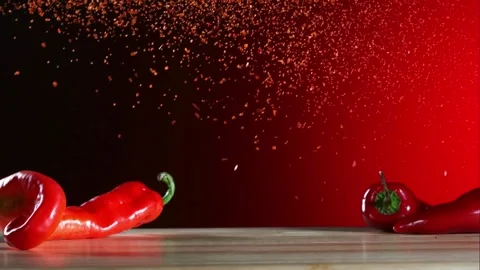 Spicy fried chicken wings falling with red chili peppers Stock Footage 327581150
