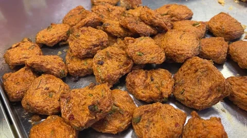 Spicy fried snacks Rotating Fried Chicken Pieces on Colored Background. Fresh Stock Footage 310421292