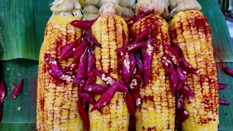 Spicy Grilled Corn Cobs with Red Chili Peppers at Thai Street Food Market Video stock 335998852