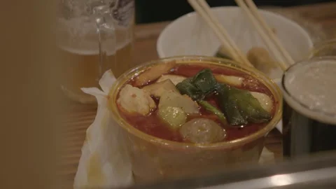 Spicy Hot Pot and Drinks on Table in Beijing Bar, Close-Up of Chinese Dining Stock Footage 345751292