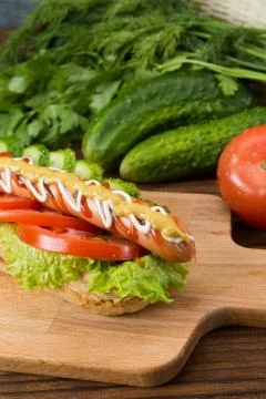 Spicy hotdog with fresh vegetables Stock Photos
