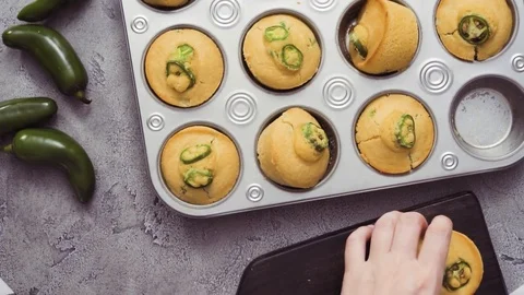 Spicy jalapeno cornbread muffins in wired basket. Stock Footage 97152541