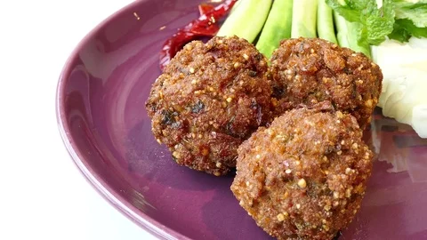 Spicy marinated pork balls served with vegetable Stock Footage 77010870