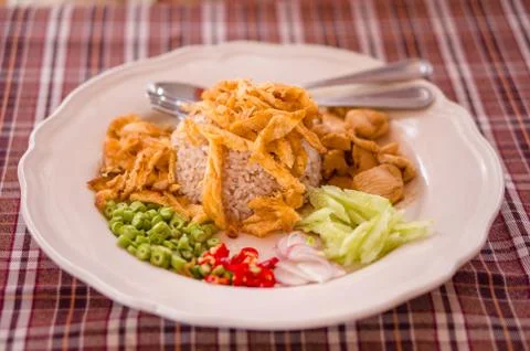 Spicy rice with chicken, eggs, pepper salad Stock Photos
