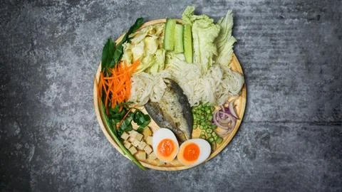 Spicy rice noodle salad withe herb on cement table. Stock Photos