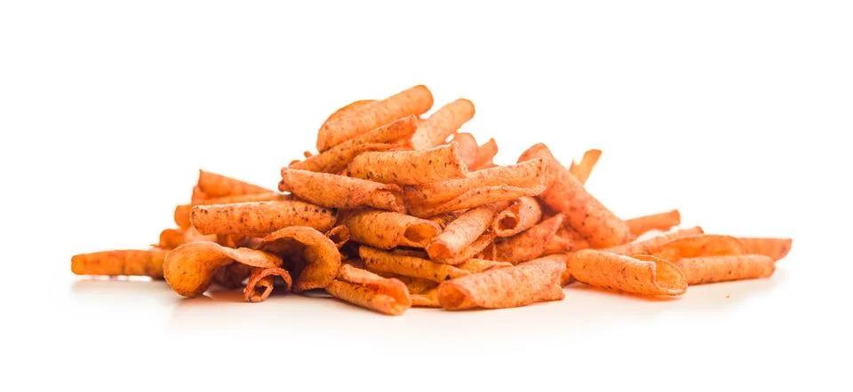 Spicy Rolled Corn Chips Stack Closeup On White Background For Snack Food Ad.. Stock Photos