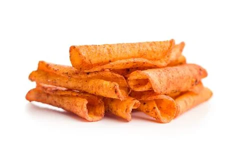 Spicy Rolled Corn Chips Stack Closeup On White Background For Snack Food Ad.. Stock Photos