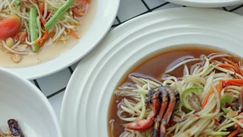 Spicy Seafood Noodle Salad with Shrimp, Green Papaya, Tomato, Bean Sprout Stock Footage 346095341