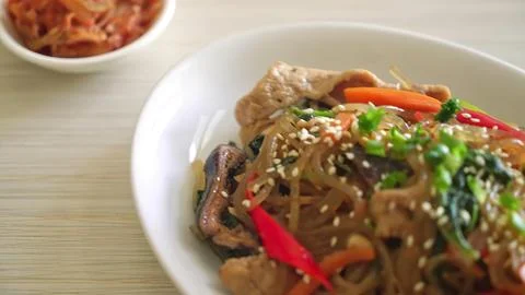 Spicy stir-fried beef with vegetables on white plate Stock Photos