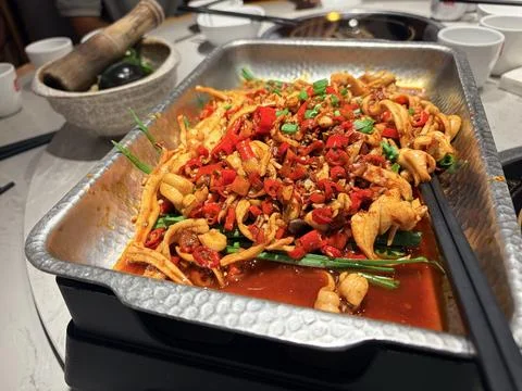 Spicy Stir-Fried Squid with Red Peppers and Green Onions Stock Photos