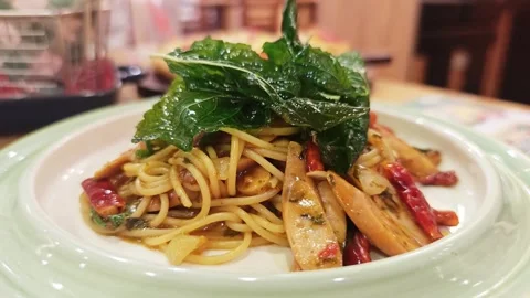 Spicy Thai style spaghetti with crispy basil. Stock Footage 340201127