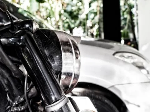 Spider created a web on the motorcycle during the lockdown period Stock Photos