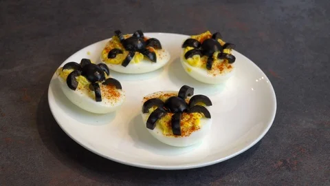 Spider Deviled Eggs on a White Plate. Healthy Halloween Snack Recipe. 스톡 동영상 117502021