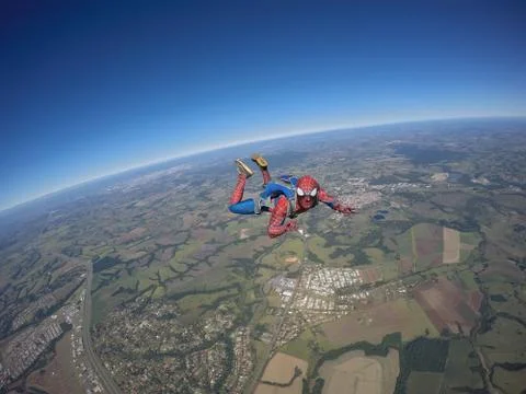 Spider man jumping out the plane Stock Photos