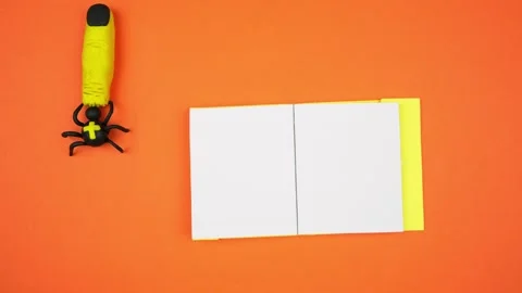A spider pulls a severed finger. Background for writing on Halloween.Stop motion Video stock 253096991