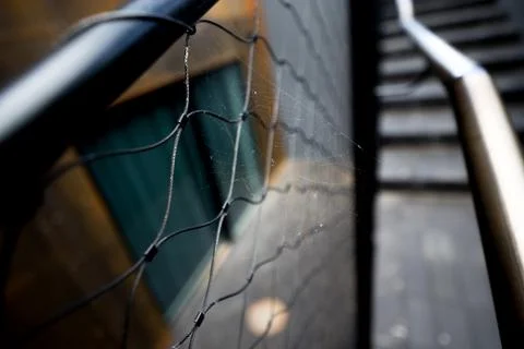 Spider web on metallic handle Foto stock